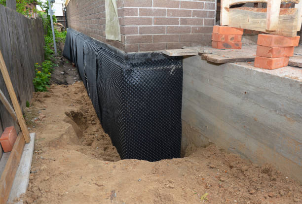 Happy homeowners after waterproofing job in Vancouver